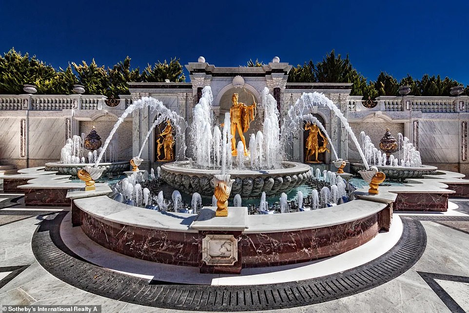 Outside, the mansion has landscaped gardens, two fountains with golden Roman sculptures and monumental columns