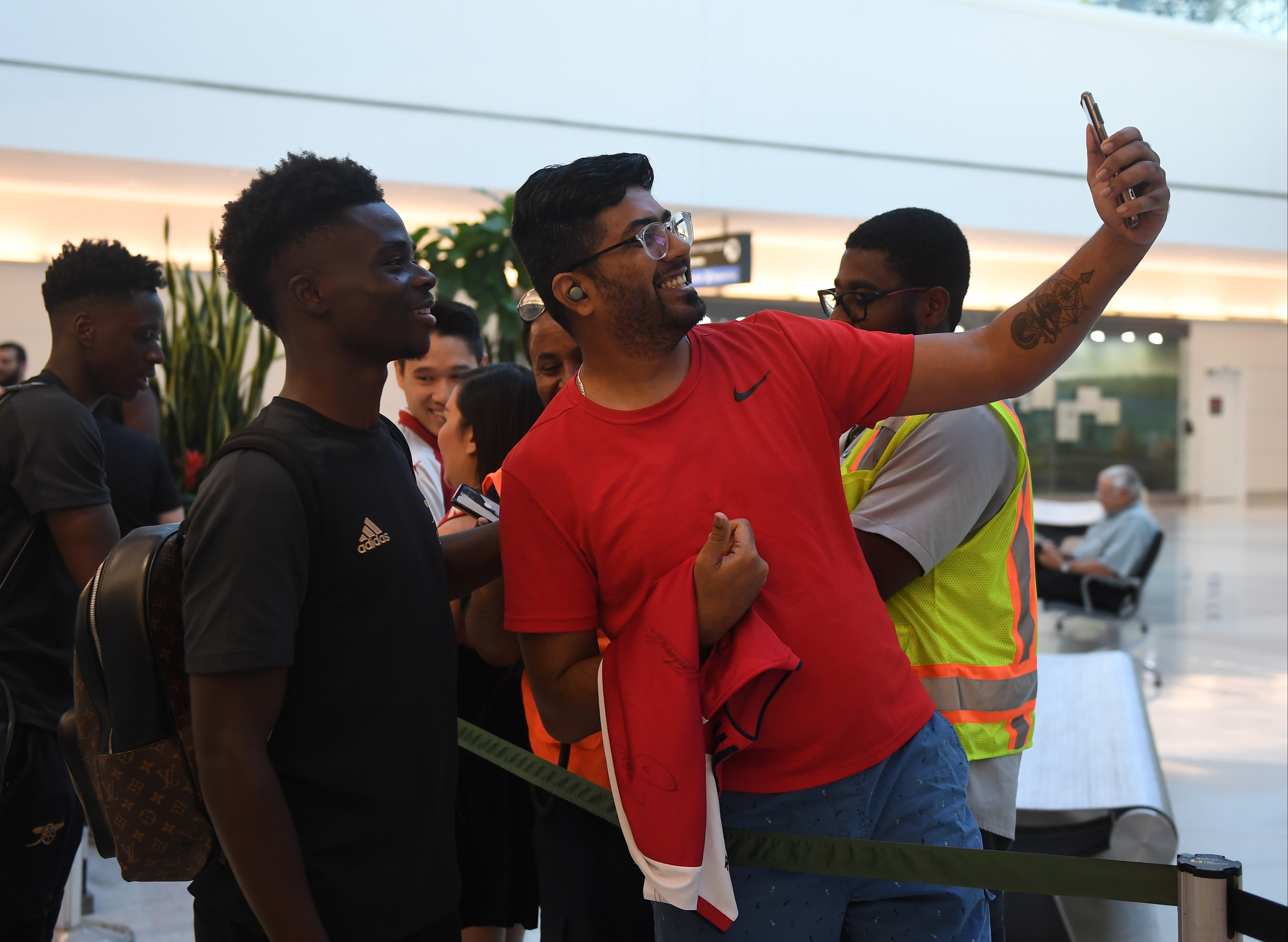 England star Saka was one of a host of Arsenal players who stopped for photos