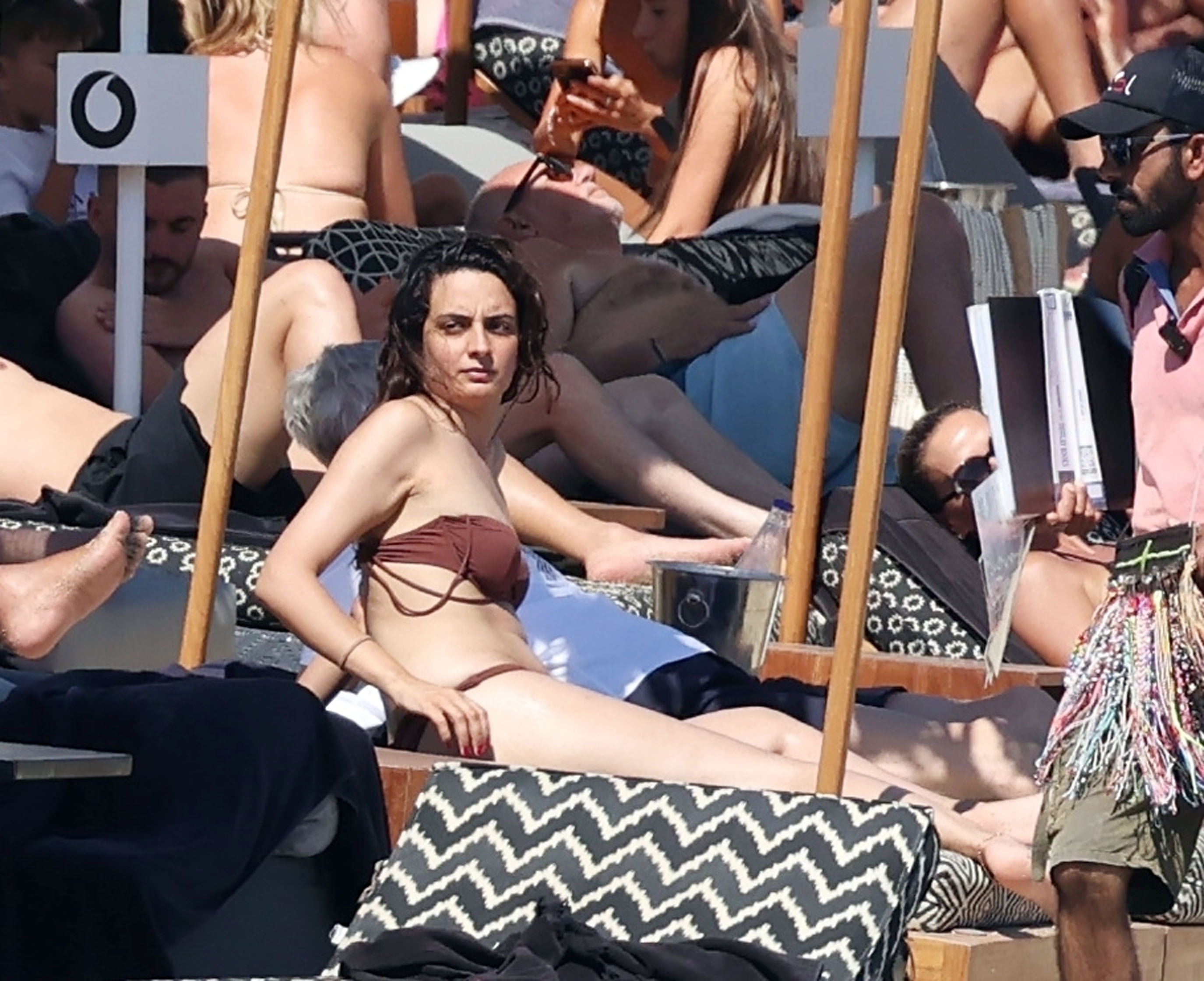 The mystery woman stunned in a brown bikini