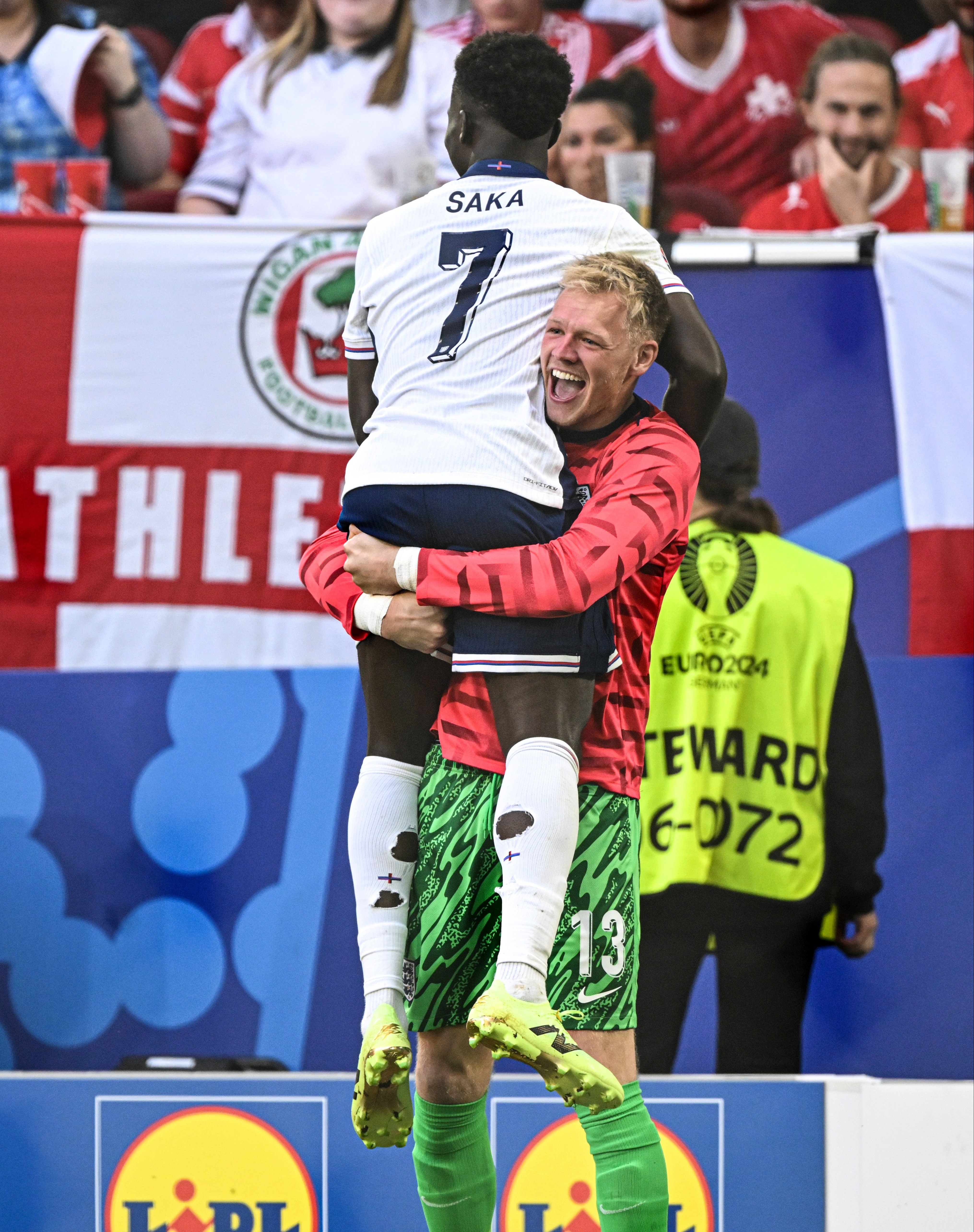 Arsenal team-mate Aaron Ramsdale lifted Saka aloft after his goal