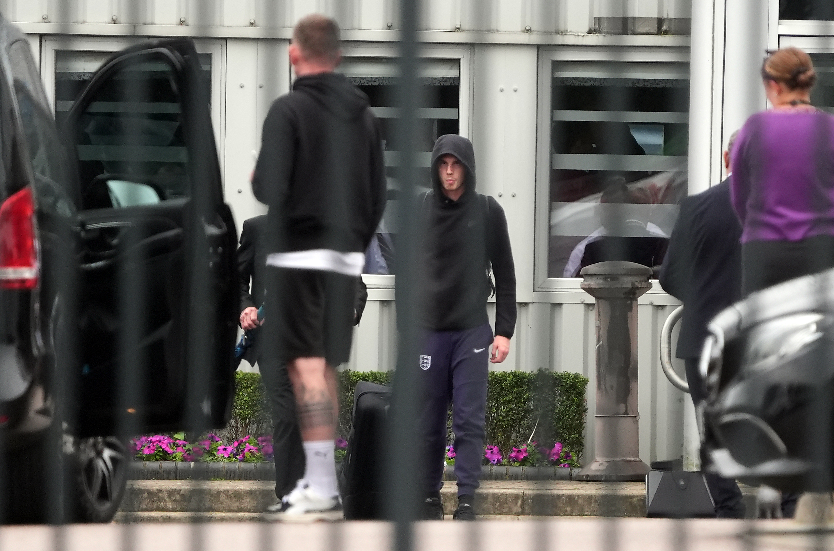 Cole Palmer - who notched England's equaliser in the final - stands back with this hood up