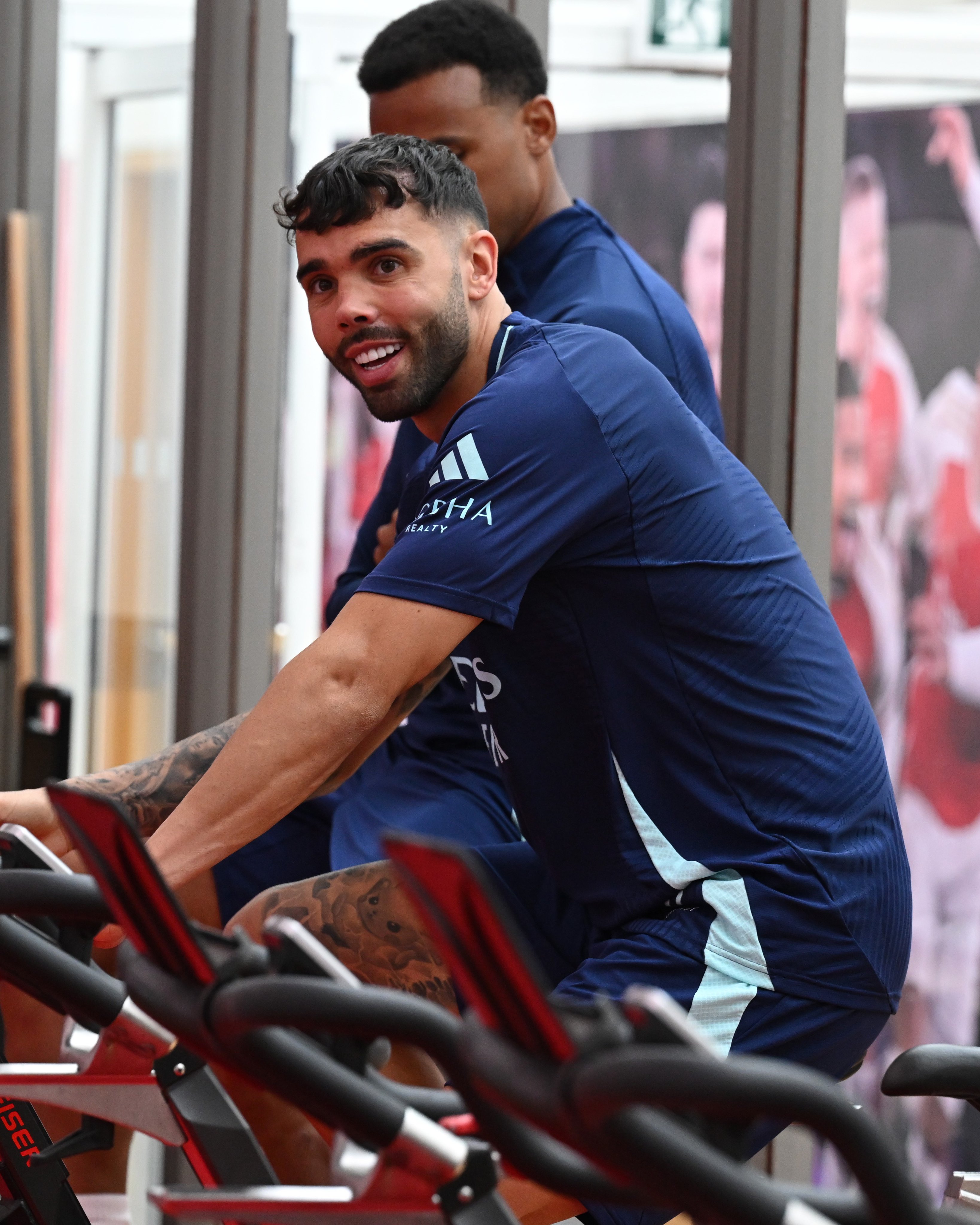 David Raya warming up on a bike in the gym.