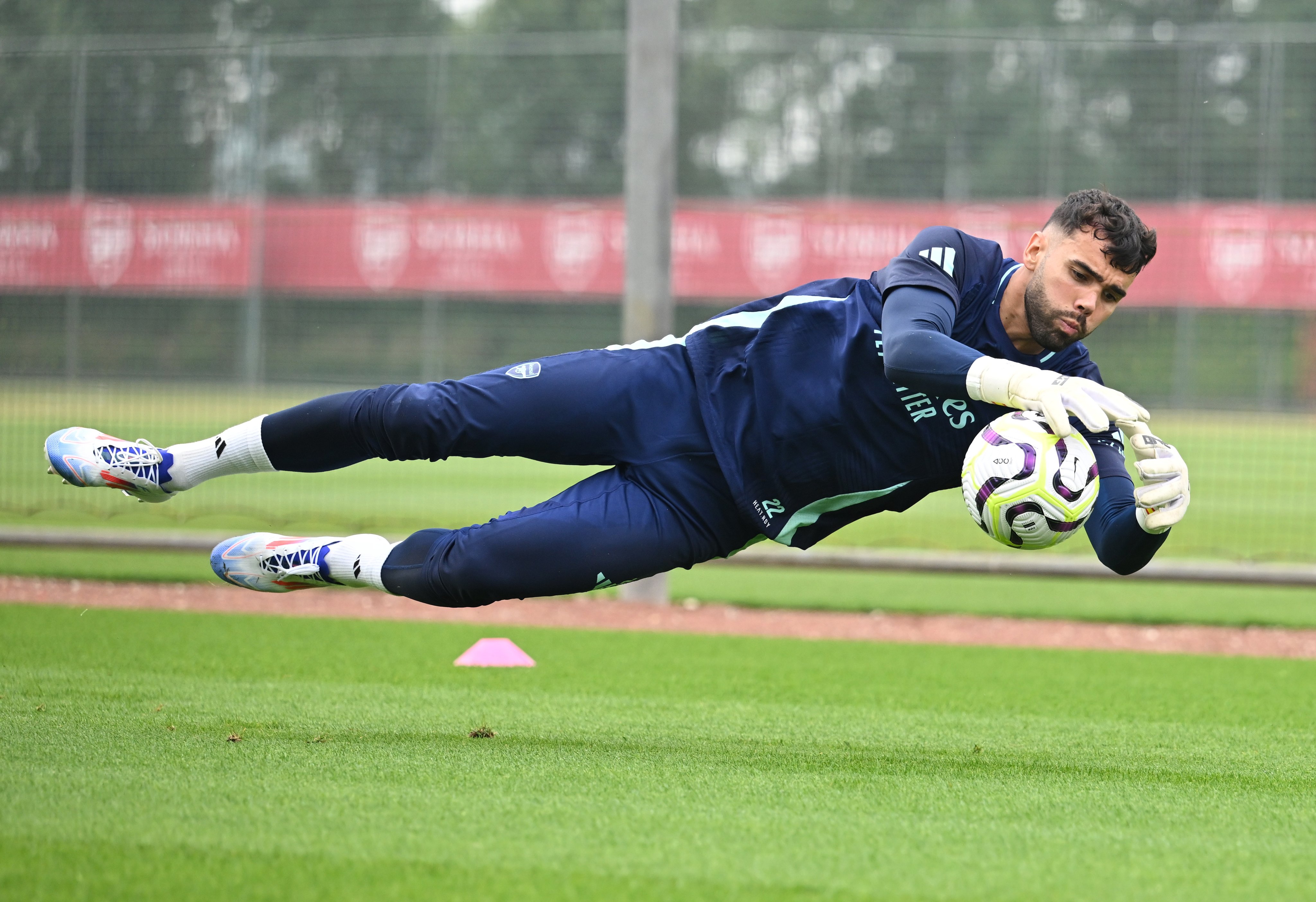 David Raya makes a save in training.