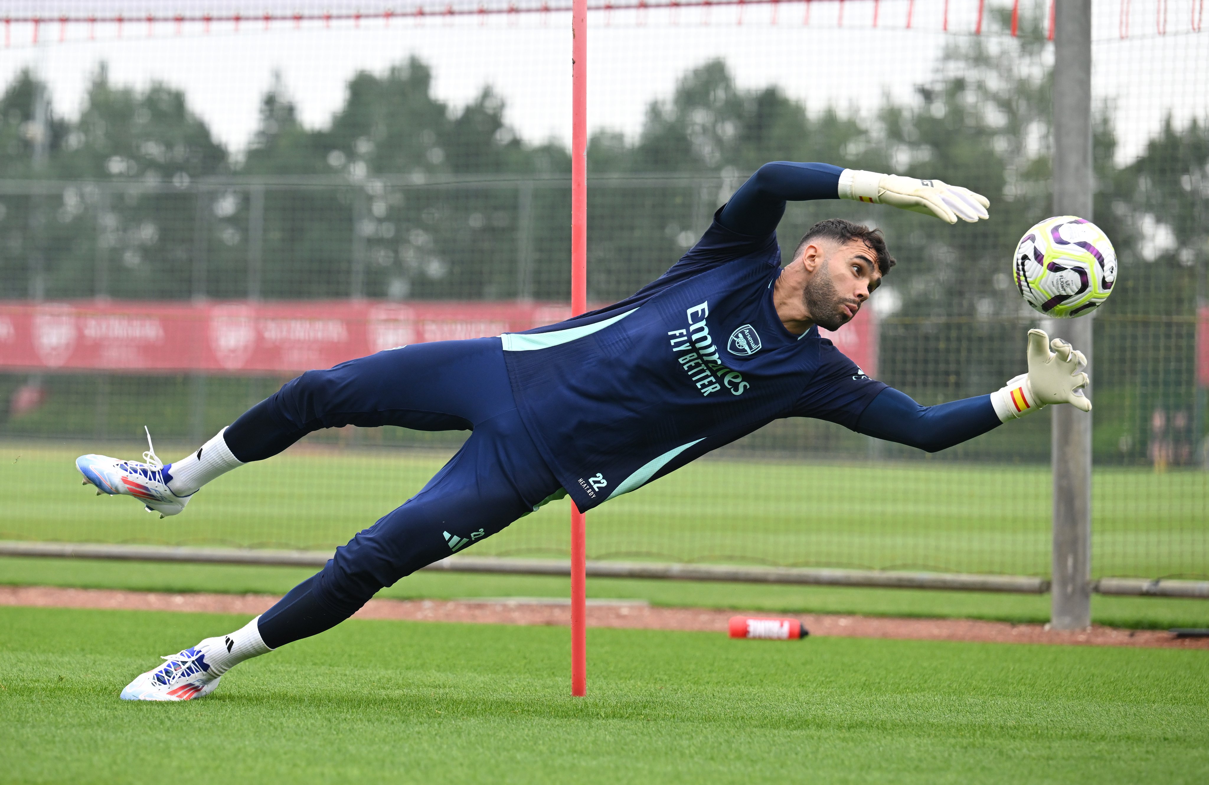 David Raya makes a save in training.