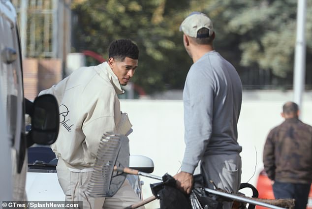 Jude Bellingham clutches a £1,500 Goyard washbag as he runs errands back in Madrid after pulling out of the England squad through injury | Daily Mail Online