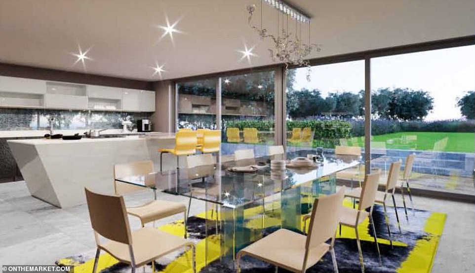 The kitchen-diner looks out to the back garden of the property through huge sliding glass doors