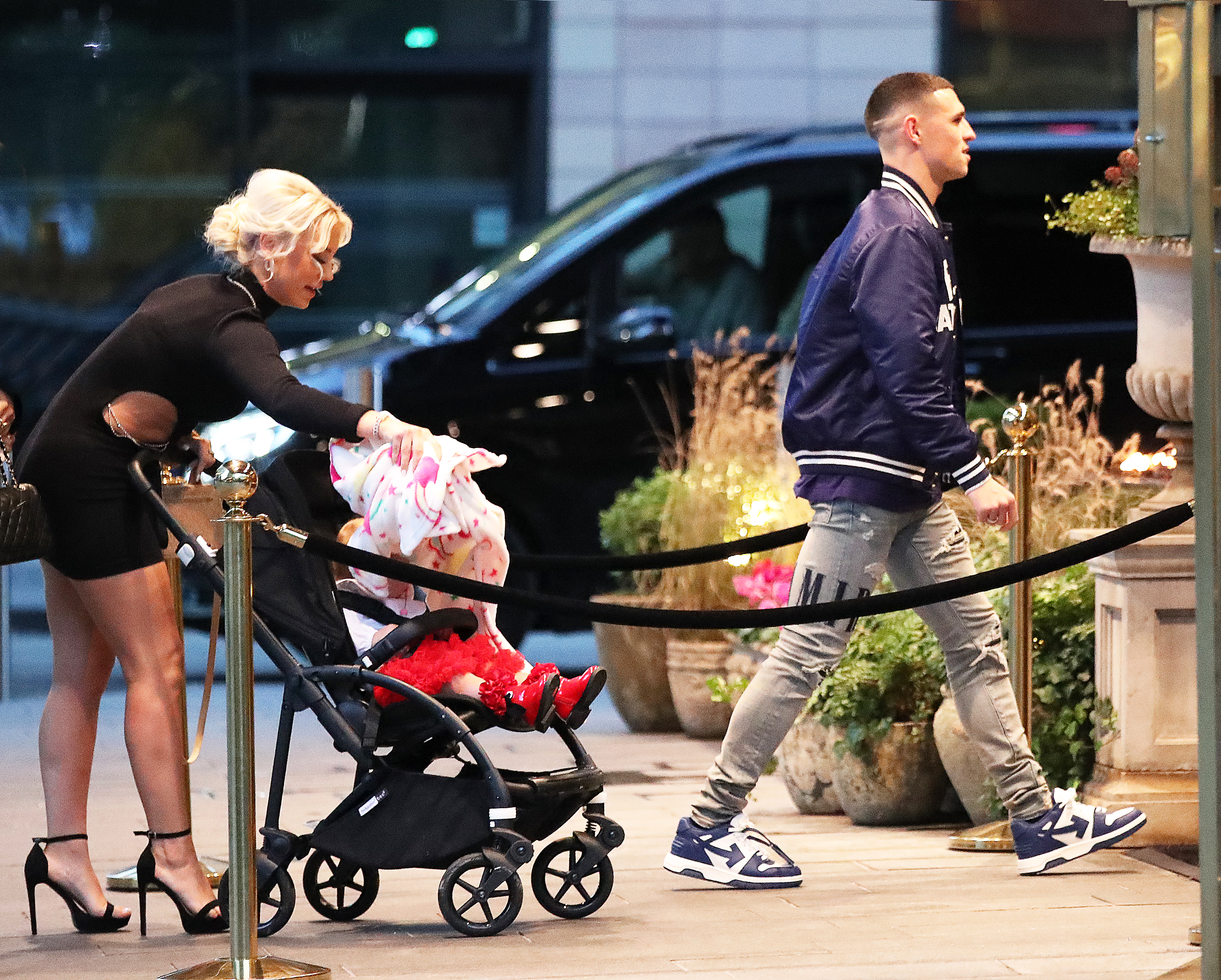 Partner Rebecca and their child could be seen walking in behind Foden