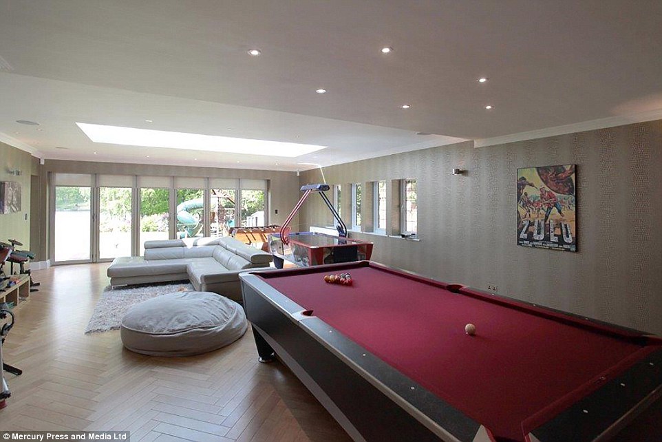 The £3.4million on a six-bedroom Cheshire mansion features a games room complete with pool and air hockey tables 